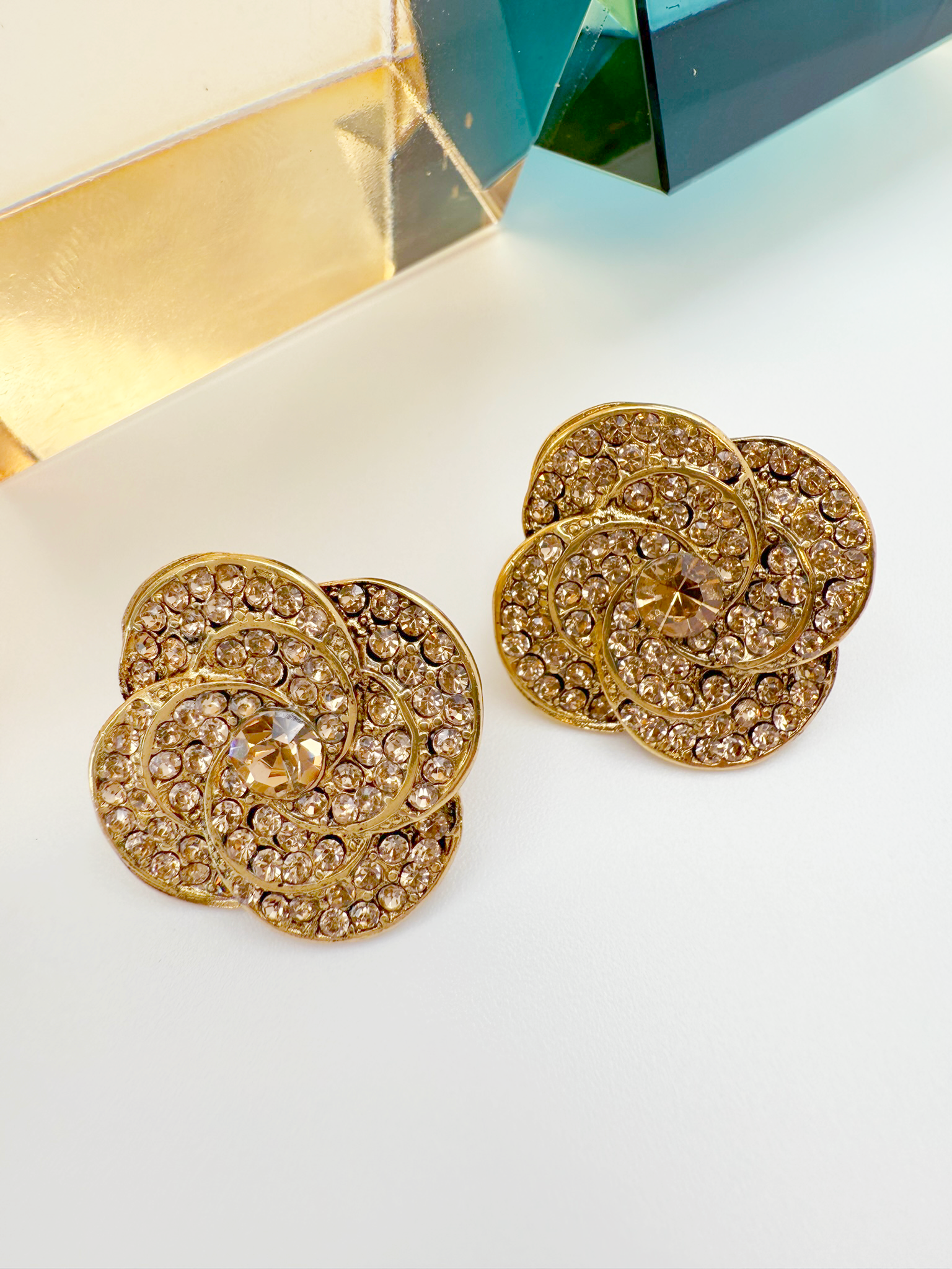 Dazzling Floral Swirl Stud Earrings – Gold &amp; Crystal Design